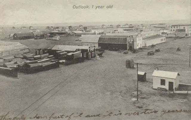 Outlook, 1 year old: lumber yards and buildings